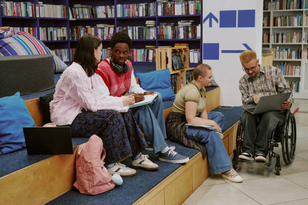 istock Group of Friends Collaborating in University Library 2182141647