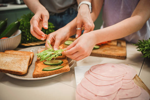 istock mother and daughter cooking in the kitchen 2182147014