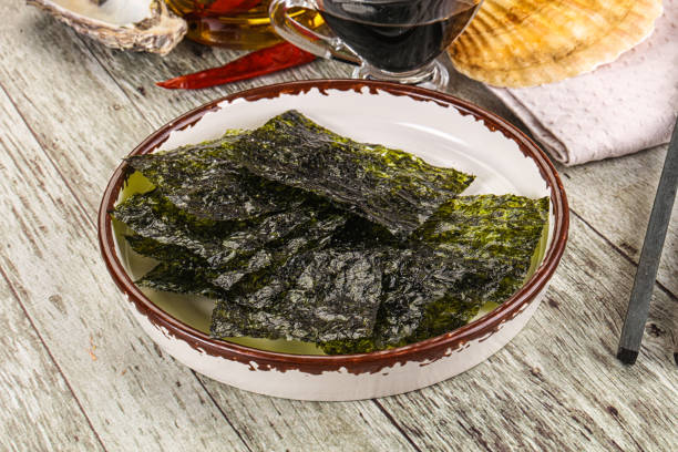 istock Green nori seaweed chips with soya sauce 2182148053