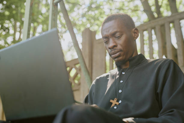 Priest Resting on Wooden Bench