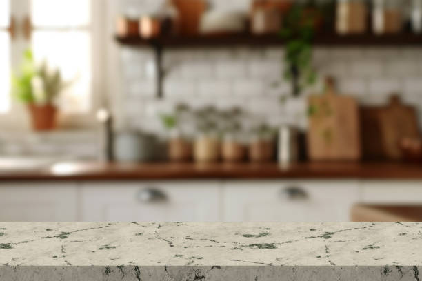 istock Empty stone white table the bright interior of the kitchen as a blurred background behind the bokeh 2182150514