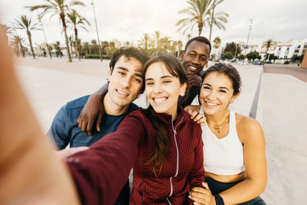 istock Happy friends taking a selfie in a sunny outdoor setting 2182151686
