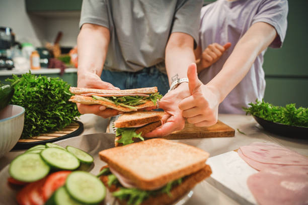 istock mother and daughter cooking in the kitchen 2182153670