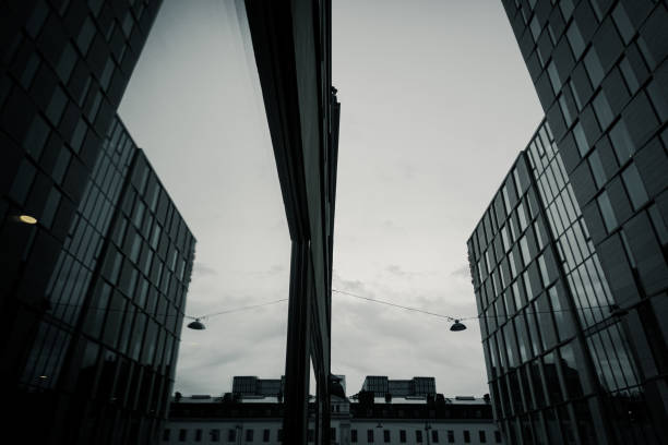 Low angle of a window with the reflection of a building