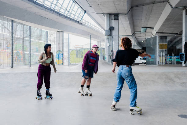 istock Skaters talking and skating on a skateboard park 2182154801