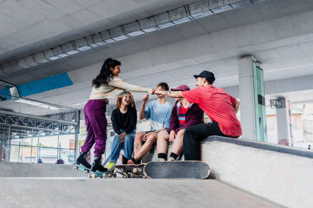 istock Skater greeting friends on a skateboard park 2182154813