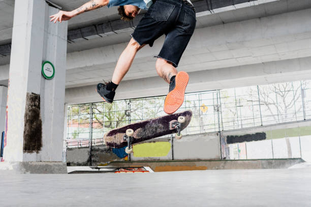 istock Skater skating on a skateboard park 2182155062