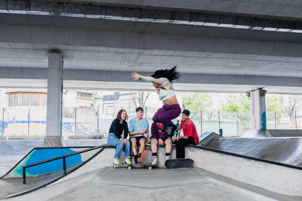 istock Friends looking skater skating on a skateboard park 2182155090