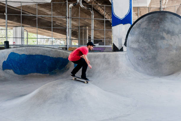 istock Skater skating on a skateboard park 2182155112