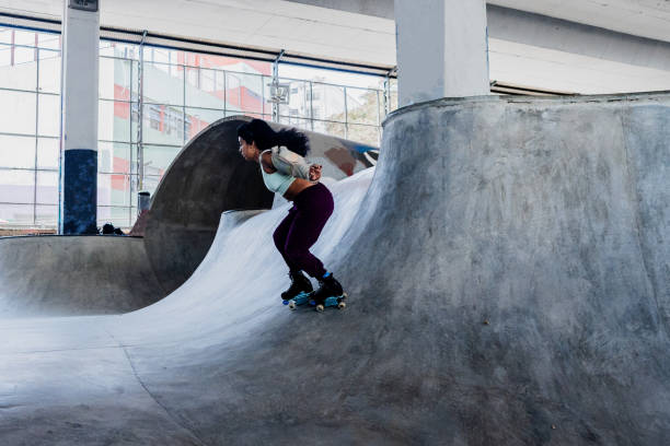 istock Skater skating on a skateboard park 2182155133