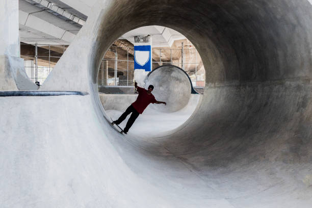 istock Skater skating on a skateboard park 2182155153