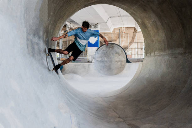 istock Skater skating on a skateboard park 2182155163