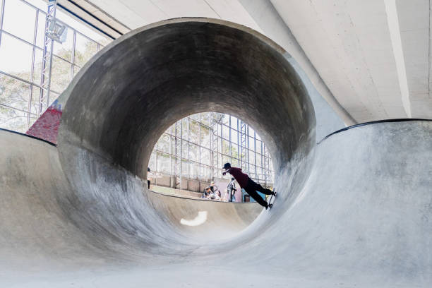 istock Skater skating on a skateboard park 2182155172