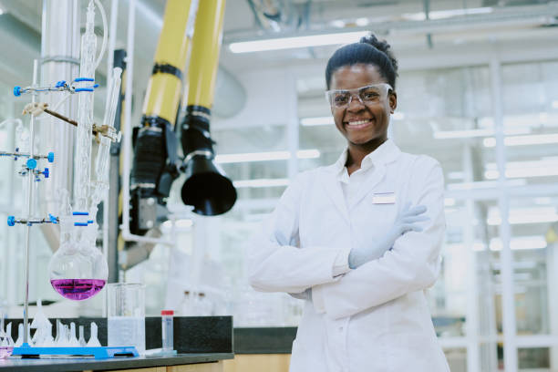 istock Portrait of Smiling Scientist Conducting Experiment 2182156425