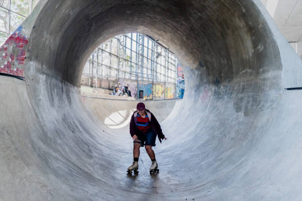istock Skater skating on a skateboard park 2182156479