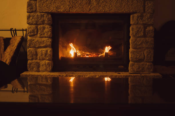 istock Italian Country House Mantelpiece with Firelight Reflections on Glass Coffee Table 2182159363