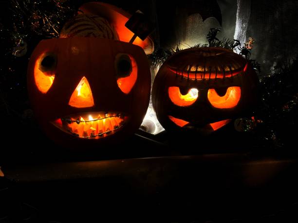 istock Halloween carved pumpkin at night 2182164938