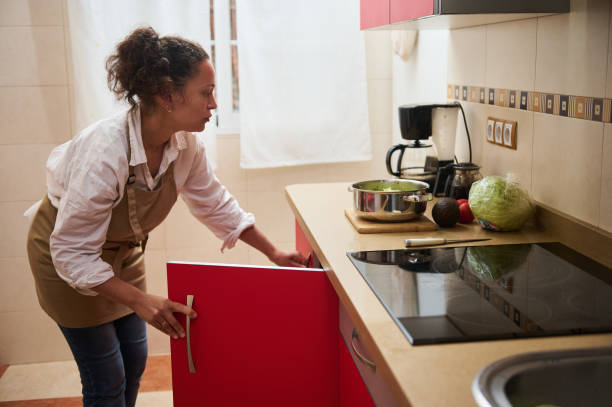 istock Woman preparing healthy meal in modern kitchen with fresh vegetables 2182171378