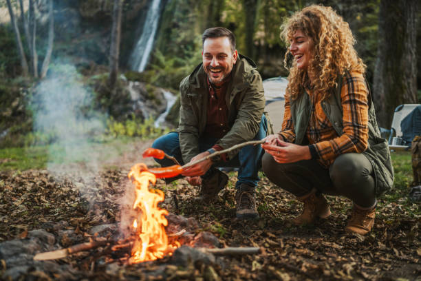istock hiker couple enjoy on the camp while grill and eat sausage 2182173895