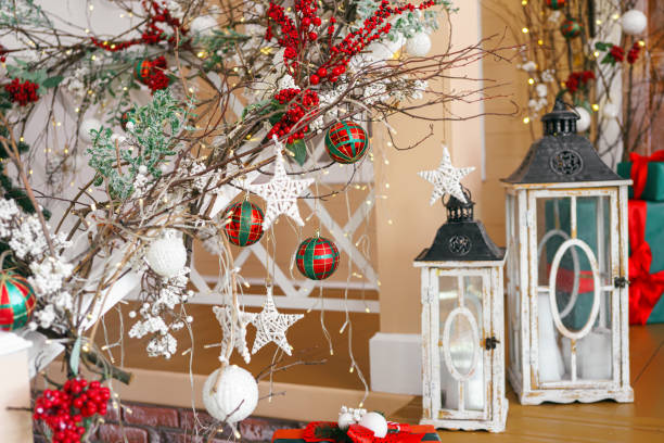istock Festive holiday decorations, branches, ornaments and lanterns in cozy winter setting for Christmas 2182174494