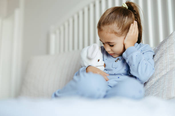 istock Little girl having an earache 2182175079