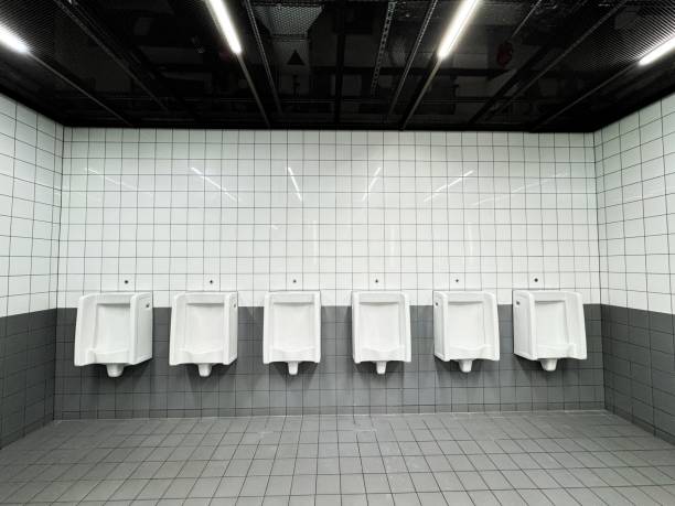 A new clean modern gents toilet block with wash basins and urinals