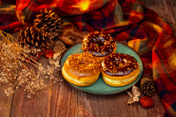 istock Autumn Holiday Donuts on a Retro Wood Background 2182182297