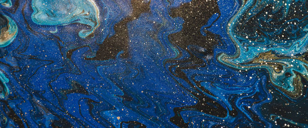 istock Fluid art background in blue tints with gilding. Flowing wave effect of liquid ink. Dark phantom blue with golden stains. Fantasy abstract texture of acrylic paints. Surreal color mix. Gold on blue. 2182187820