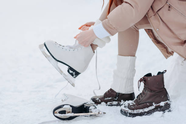 istock young redhead girl in ice rink 2182188341