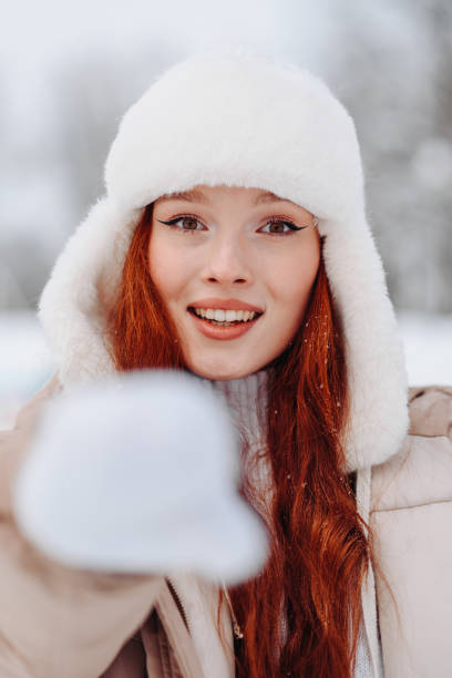 istock young redhead girl in ice rink 2182188346