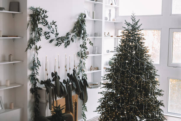 istock Cozy holiday living room decorated with a Christmas tree and greenery 2182189225