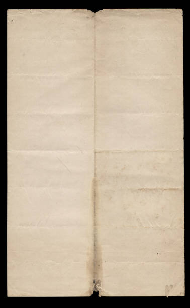 istock Old vintage torn creased paper sheet on black. 2182191943