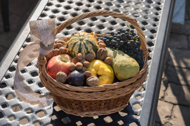 autumn basket full of fruit, hazelnuts, quinces, apples, grapes,