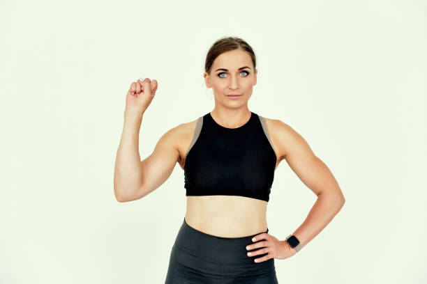 istock Fitness Trainer Raising Hand with Confident Expression. 2182198574
