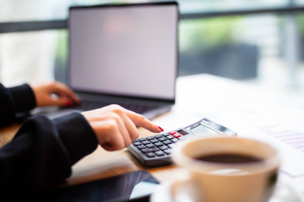 istock Close up Business woman using calculator and laptop 2182207598