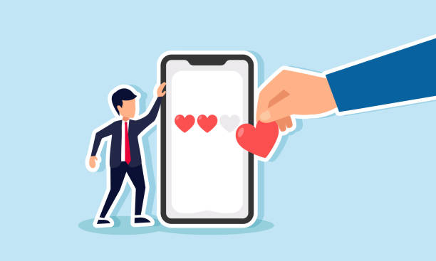 istock A businessman holding a smartphone displaying a series of hearts, with a hand bringing a heart to place on the smartphone, illustrating market evaluation of the business performance 2182209901