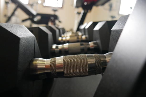 istock Close-Up of Black and Silver Drip Dumbbell with Blurred Background 2182211354