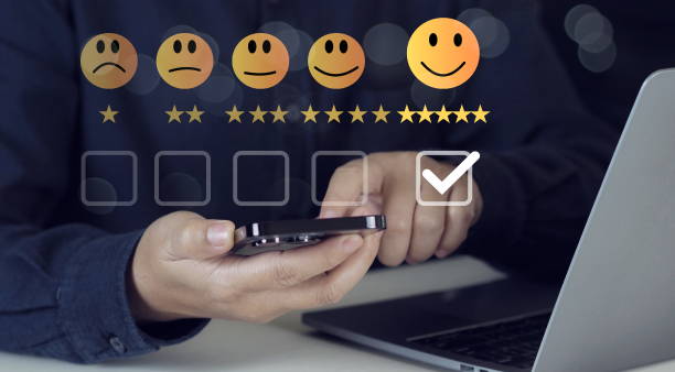 istock Customer service and Satisfaction concept ,Business people are touching the virtual screen on the happy Smiley face icon to give satisfaction in service. rating very impressed 2182212590