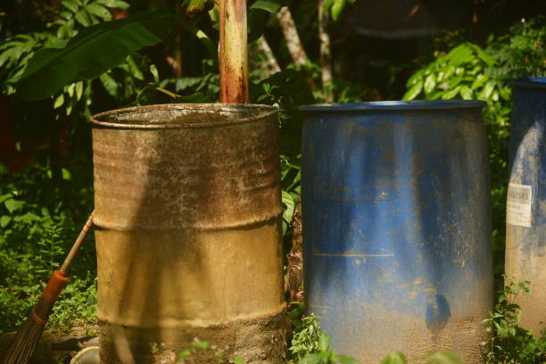 istock two water barrels made of iron and plastic 2182213226