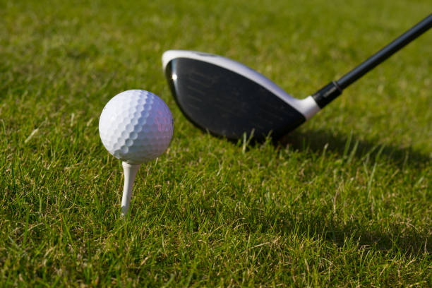 istock A golfer prepares to drive the ball from a tee on green golf course 2182213842