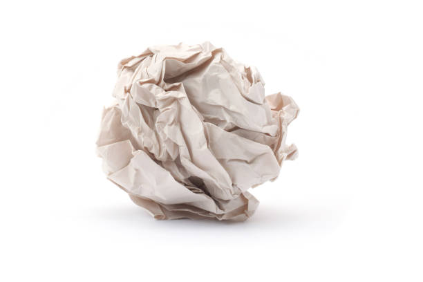 istock Crumpled paper ball closed up isolated on white 2182216205