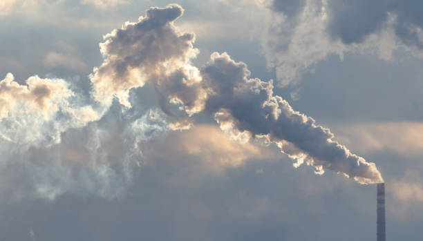 istock A large cloud of smoke is rising from a tall chimney 2182222907