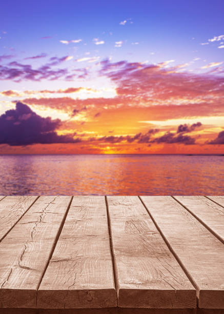 istock Empty wooden table top with tropical ocean sunrise background 2182223381