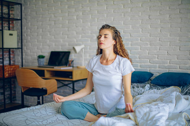 istock Morning meditating on a bed 2182223397