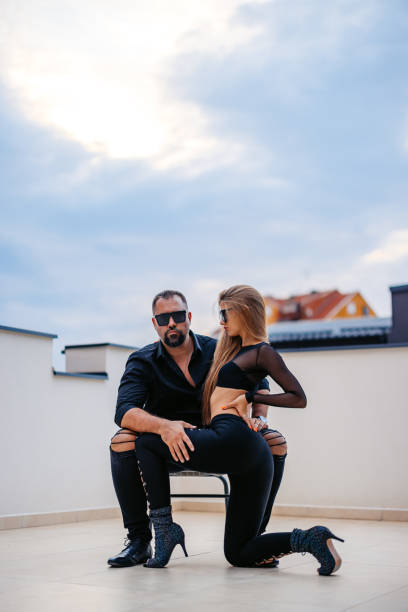 istock Modern Couple On The Building Roof 2182232874