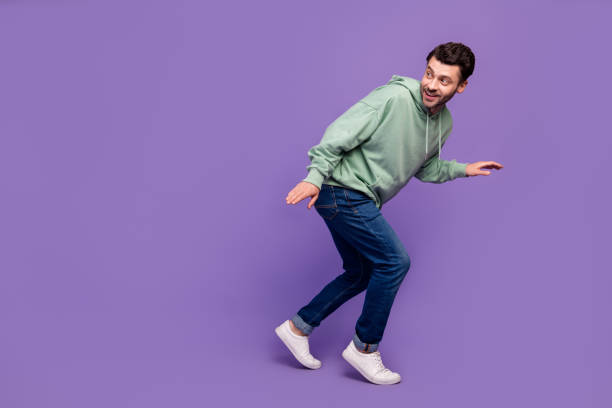 istock Full length side profile photo of nervous funny man look empty space walk silent robbery dont want wake up owners isolated on pastel violet color background 2182233708