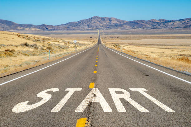 istock Long, straight desert highway with START 2182233820