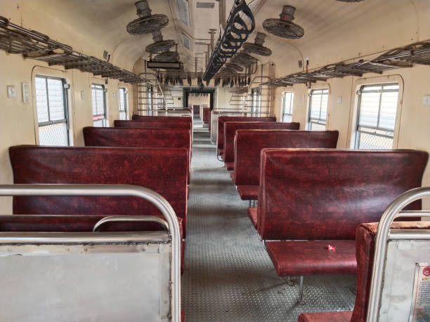 istock Indian passenger memu train interior. New general coach. Empty cabin of a modern passenger train. Empty blue seats inside train cabin, corridor view, no people. 2182235320