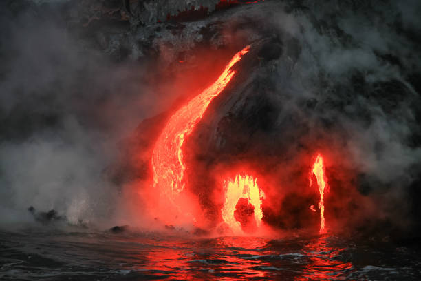 istock Red hot lava flowing into Pacific Ocean on Big Island, Hawaii 2182238381