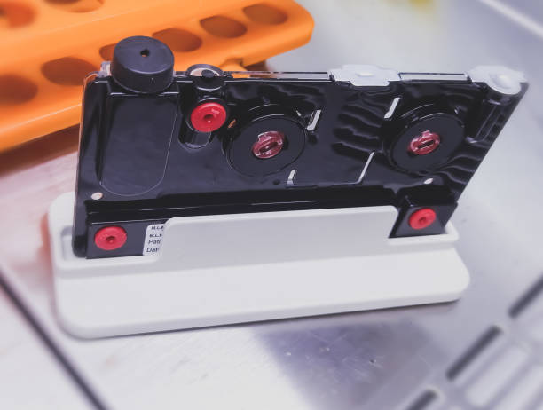 istock Fully automatic sample prep device works in tandem with cartridge and reagent Kits for extraction and purification of nucleic acids from clinical specimen. PCR Extraction cartridge. 2182238562